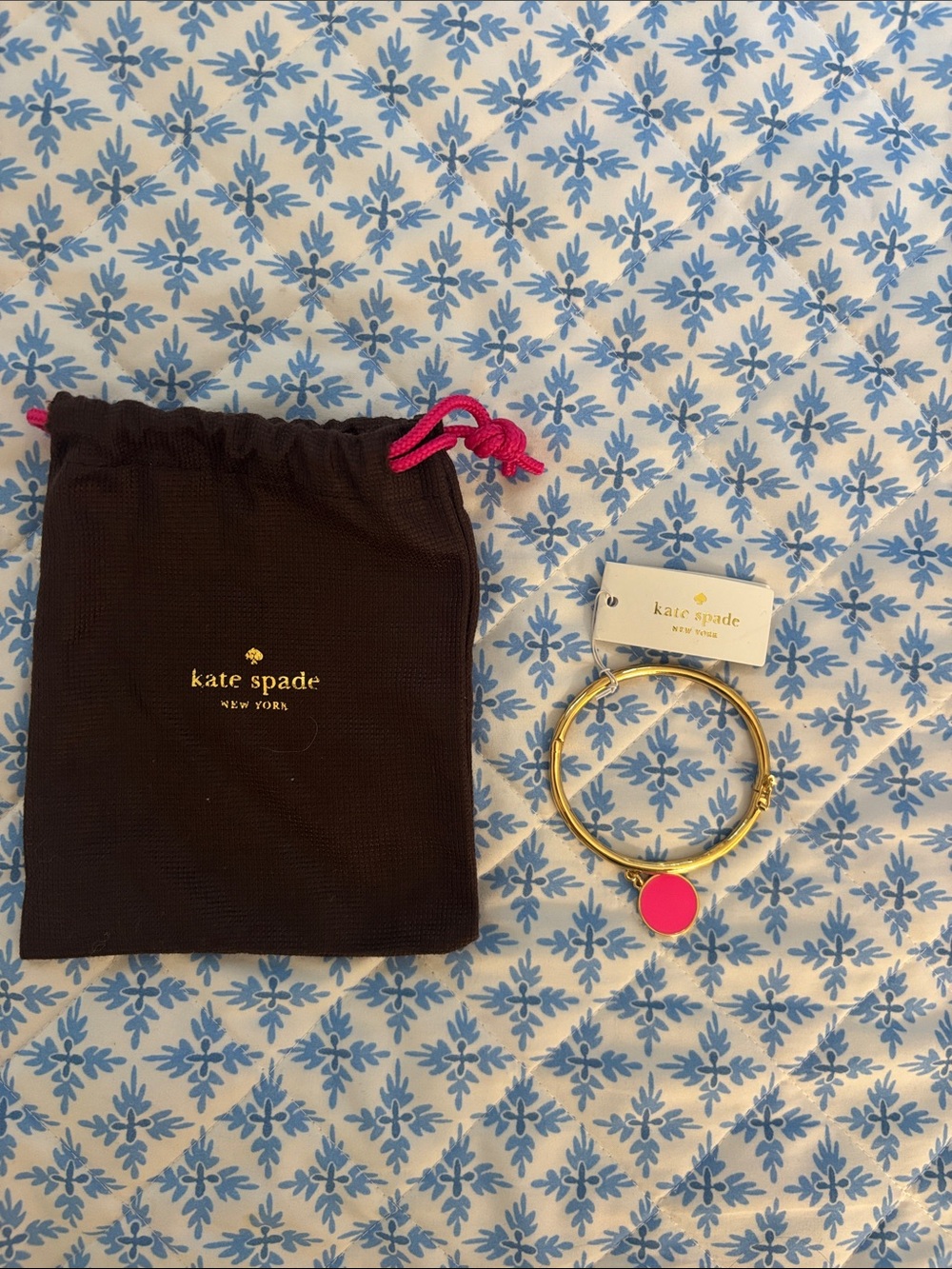 kate spade gold bangle with hot pink enamel charm